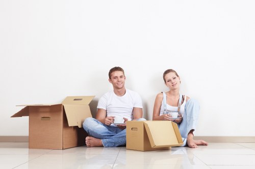 Careful packing of fragile household items in Osterley